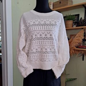 White knit sweater with a boho touch